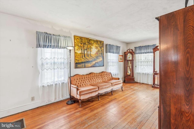 sitting room featuring light hardwood / wood-style floors