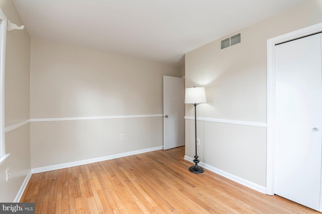 empty room with light wood-type flooring