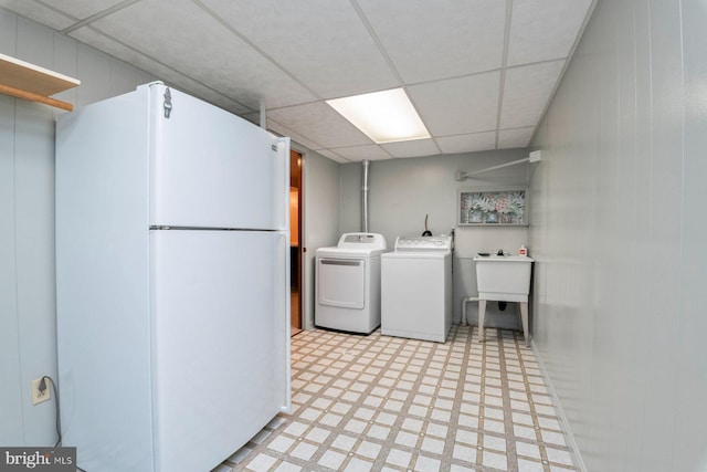 laundry area featuring washer and dryer and sink