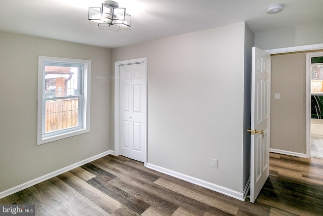 5006 Edgewood Rd, College Park, MD 20740 - unfurnished bedroom featuring dark hardwood / wood-style floors and a closet