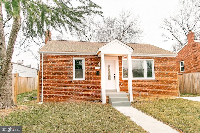 bungalow with a front yard