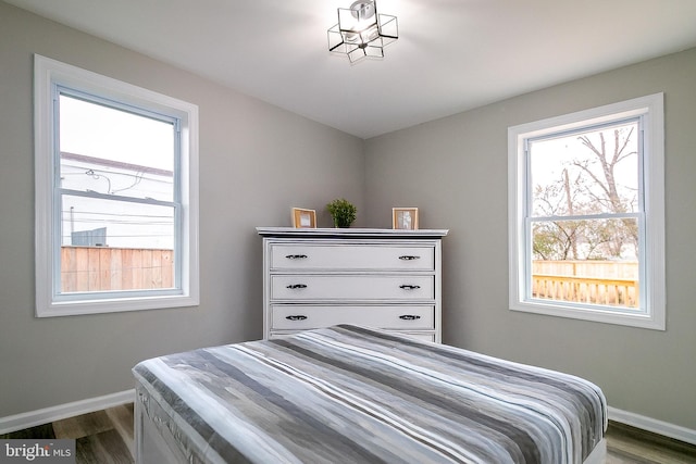 5006 Edgewood Rd, College Park, MD 20740 - bedroom with dark hardwood / wood-style floors and multiple windows