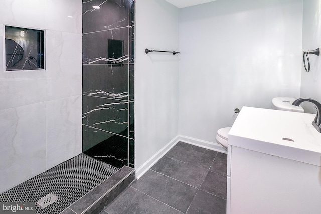 5006 Edgewood Rd, College Park, MD 20740 - bathroom with vanity, tile patterned flooring, toilet, and tiled shower