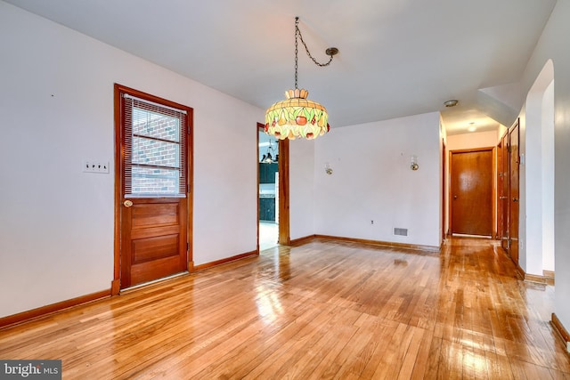 unfurnished room with light hardwood / wood-style flooring