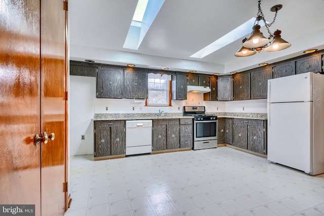 kitchen featuring pendant lighting, white appliances, a skylight, and dark brown cabinets