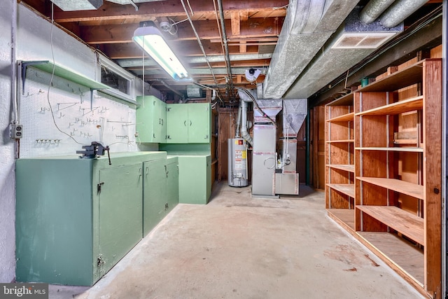 basement featuring heating unit and gas water heater