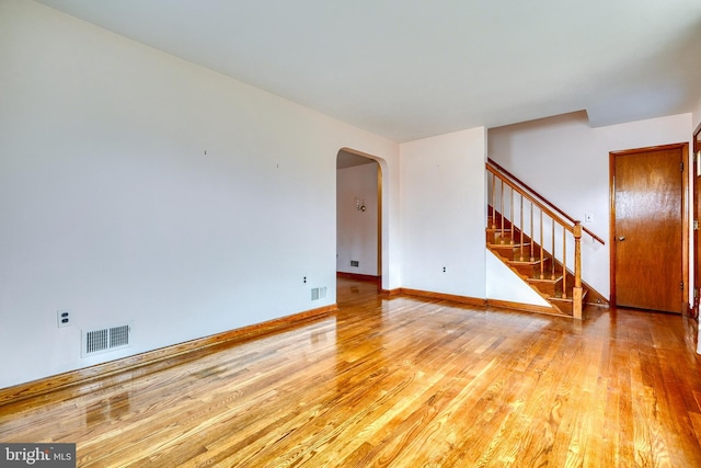 empty room with hardwood / wood-style flooring