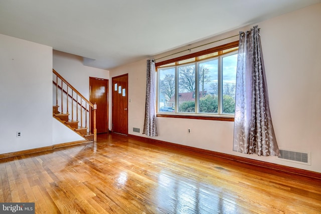 foyer entrance with wood-type flooring