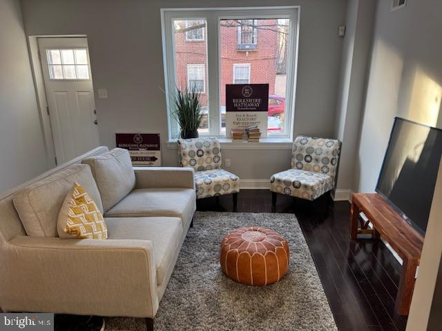 living room with dark wood-type flooring