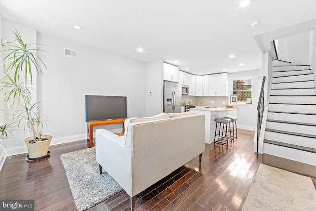 living room featuring dark hardwood / wood-style floors