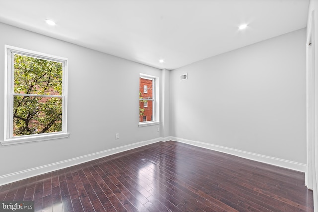 spare room featuring hardwood / wood-style floors