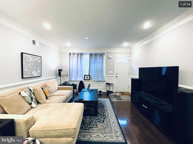 living room featuring dark wood-type flooring and crown molding