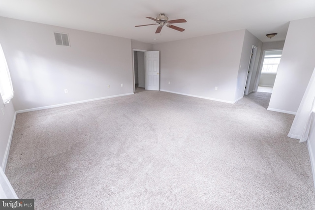 interior space with light colored carpet and ceiling fan