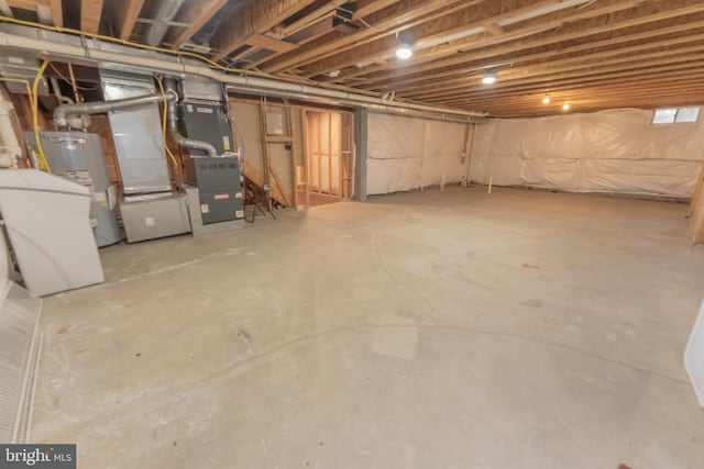 basement with water heater and heating unit