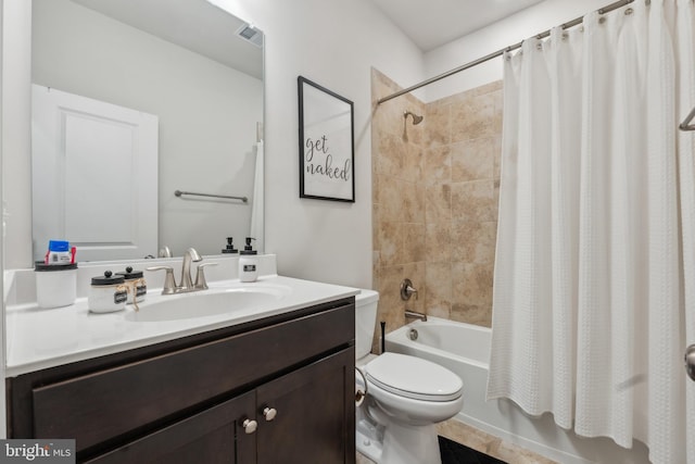 full bathroom with shower / bath combo, vanity, and toilet