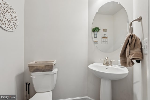 bathroom with sink and toilet