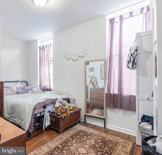 bedroom featuring dark wood-type flooring