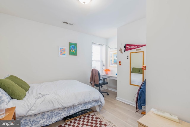 bedroom with light wood-type flooring