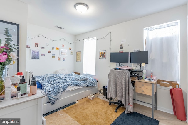 bedroom featuring multiple windows