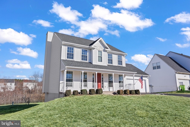 view of front of house with a front lawn and a porch