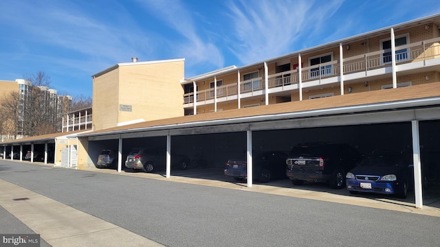 view of property featuring covered parking