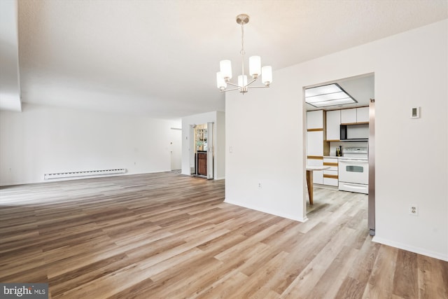 interior space with light wood-style floors, a baseboard radiator, and an inviting chandelier