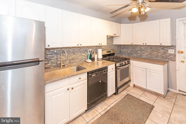 kitchen with tasteful backsplash, appliances with stainless steel finishes, light tile patterned flooring, white cabinets, and a sink