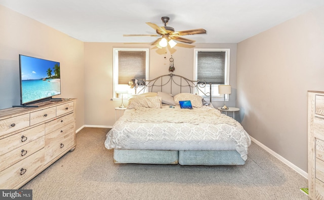 bedroom featuring ceiling fan, carpet floors, and baseboards