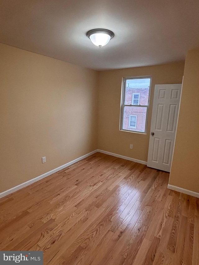 spare room with light wood-type flooring