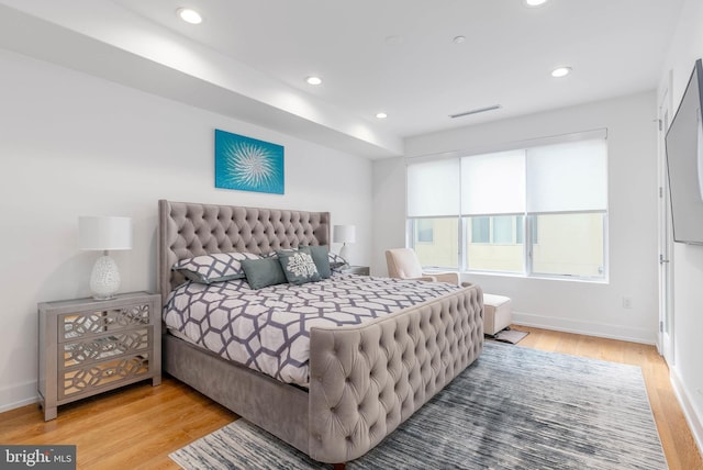 bedroom with light hardwood / wood-style flooring