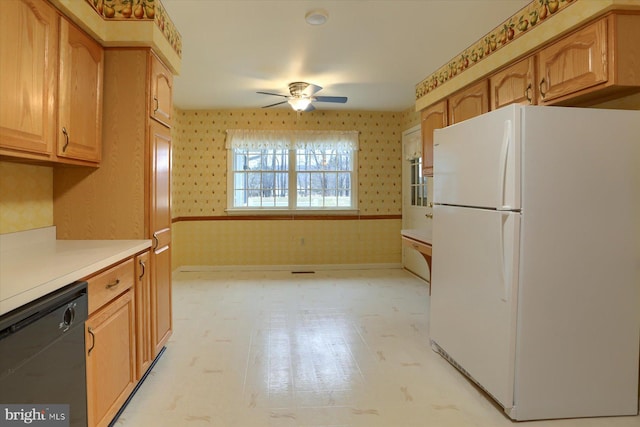 kitchen featuring ceiling fan, black dishwasher, and white fridge