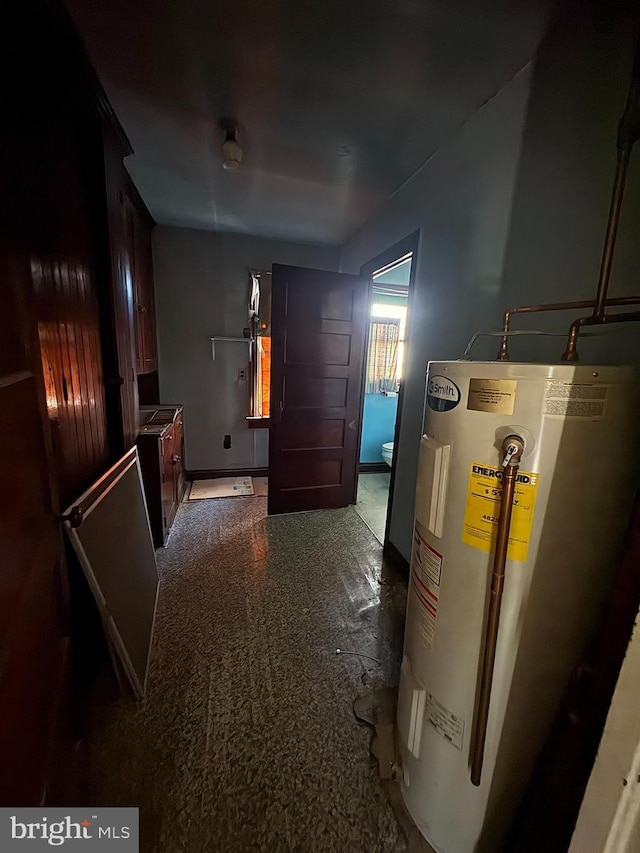 utility room featuring electric water heater