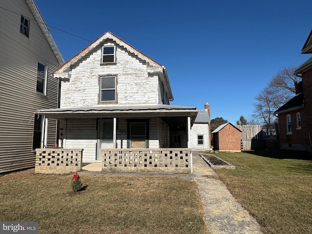 view of front of house featuring a front lawn and covered porch