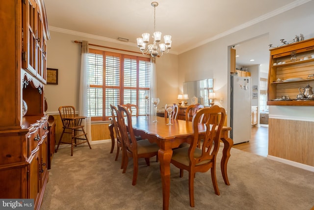 23137 Pine Run, Millsboro, DE 19966 - dining area featuring ornamental molding, light carpet, and a notable chandelier