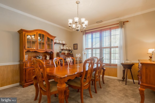 23137 Pine Run, Millsboro, DE 19966 - dining space with ornamental molding, wooden walls, light carpet, and a notable chandelier