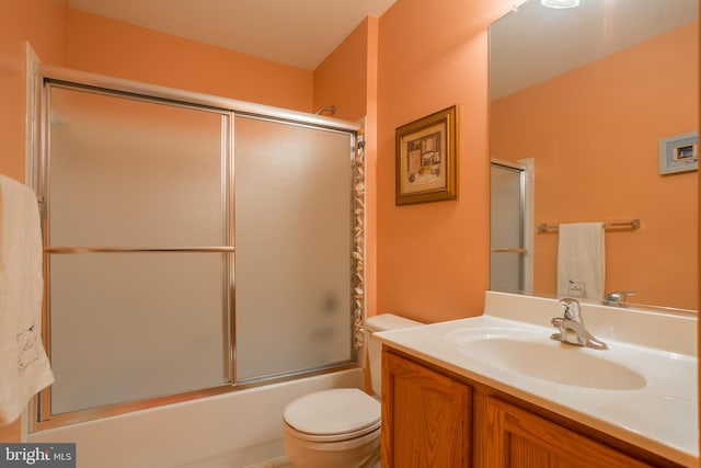 23137 Pine Run, Millsboro, DE 19966 - full bathroom featuring toilet, vanity, and bath / shower combo with glass door