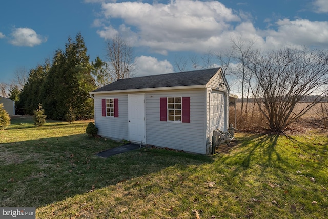 23137 Pine Run, Millsboro, DE 19966 - view of outdoor structure featuring a yard and a garage
