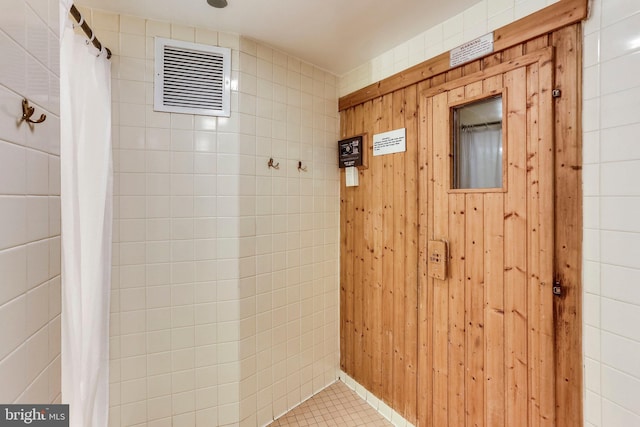 bathroom with tile patterned floors