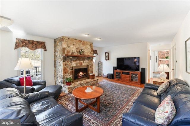 living room featuring hardwood / wood-style floors and a fireplace