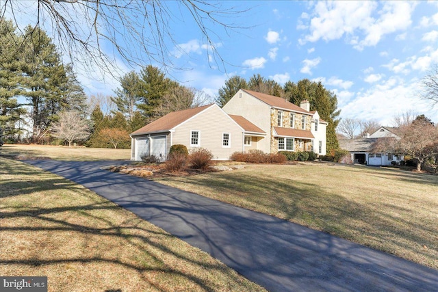 view of front of home with a front yard