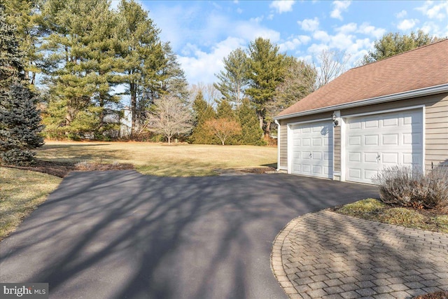 garage with a lawn