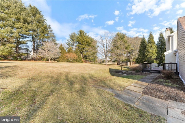 view of yard with a wooden deck