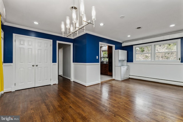 unfurnished dining area with baseboard heating, a chandelier, crown molding, and dark hardwood / wood-style floors