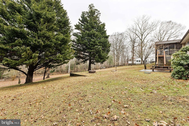 view of yard with a sunroom