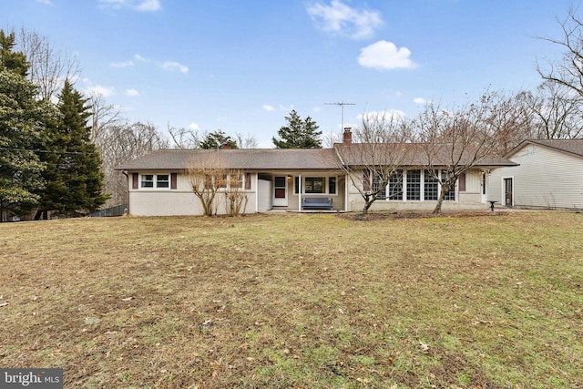 single story home featuring a front yard