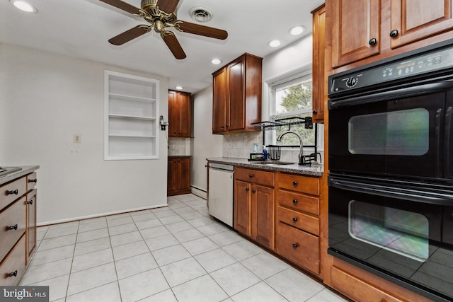 kitchen featuring tasteful backsplash, black double oven, stainless steel dishwasher, light tile patterned floors, and sink