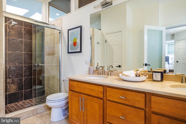 bathroom with vanity, toilet, an enclosed shower, and tile patterned flooring