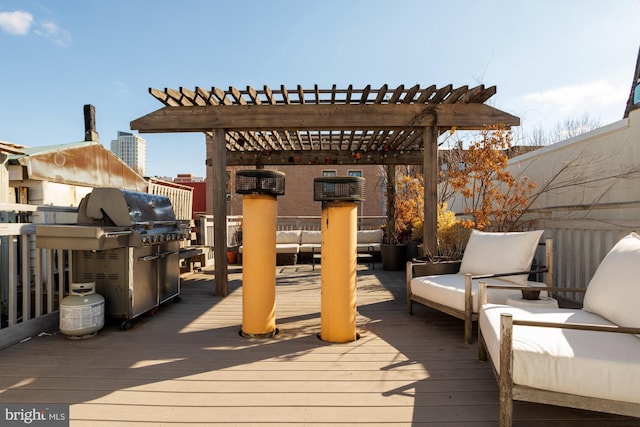 wooden terrace featuring an outdoor living space, grilling area, and a pergola