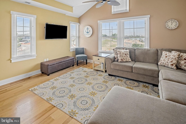 living room featuring hardwood / wood-style floors, lofted ceiling, a wealth of natural light, and ceiling fan