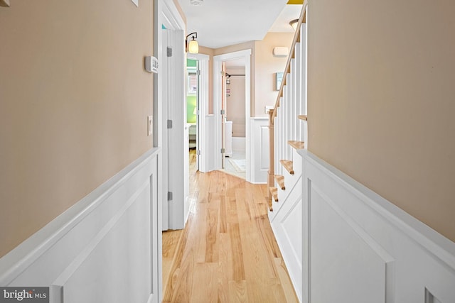 hall with light hardwood / wood-style floors